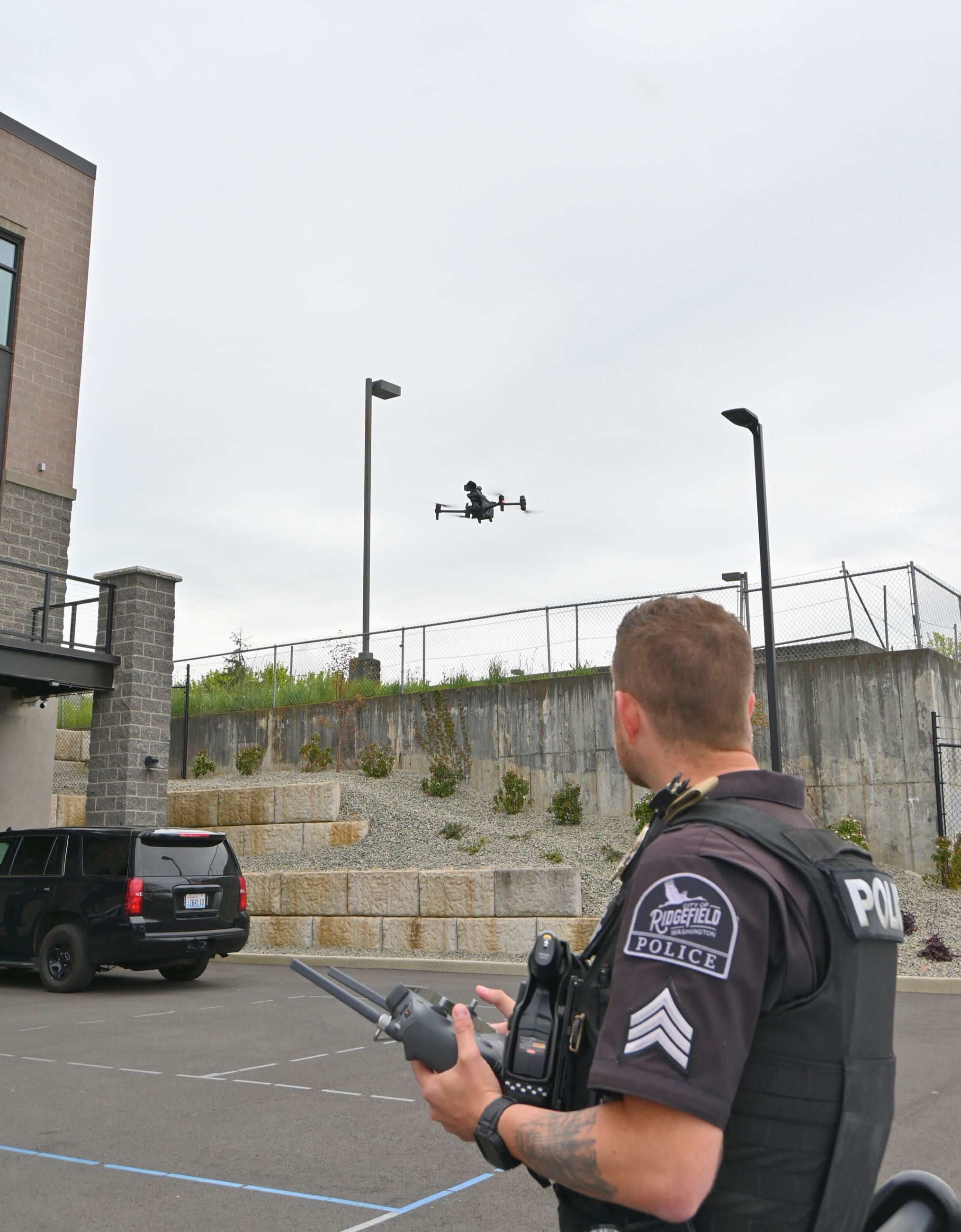 Sergeant Marvitz operates one of the department's drones above the the police department lot.