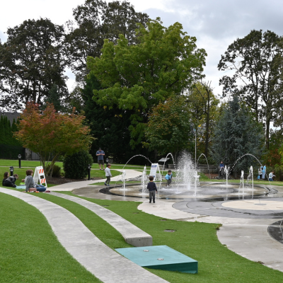 Kids playing in the splash pad at Overlook Park. 